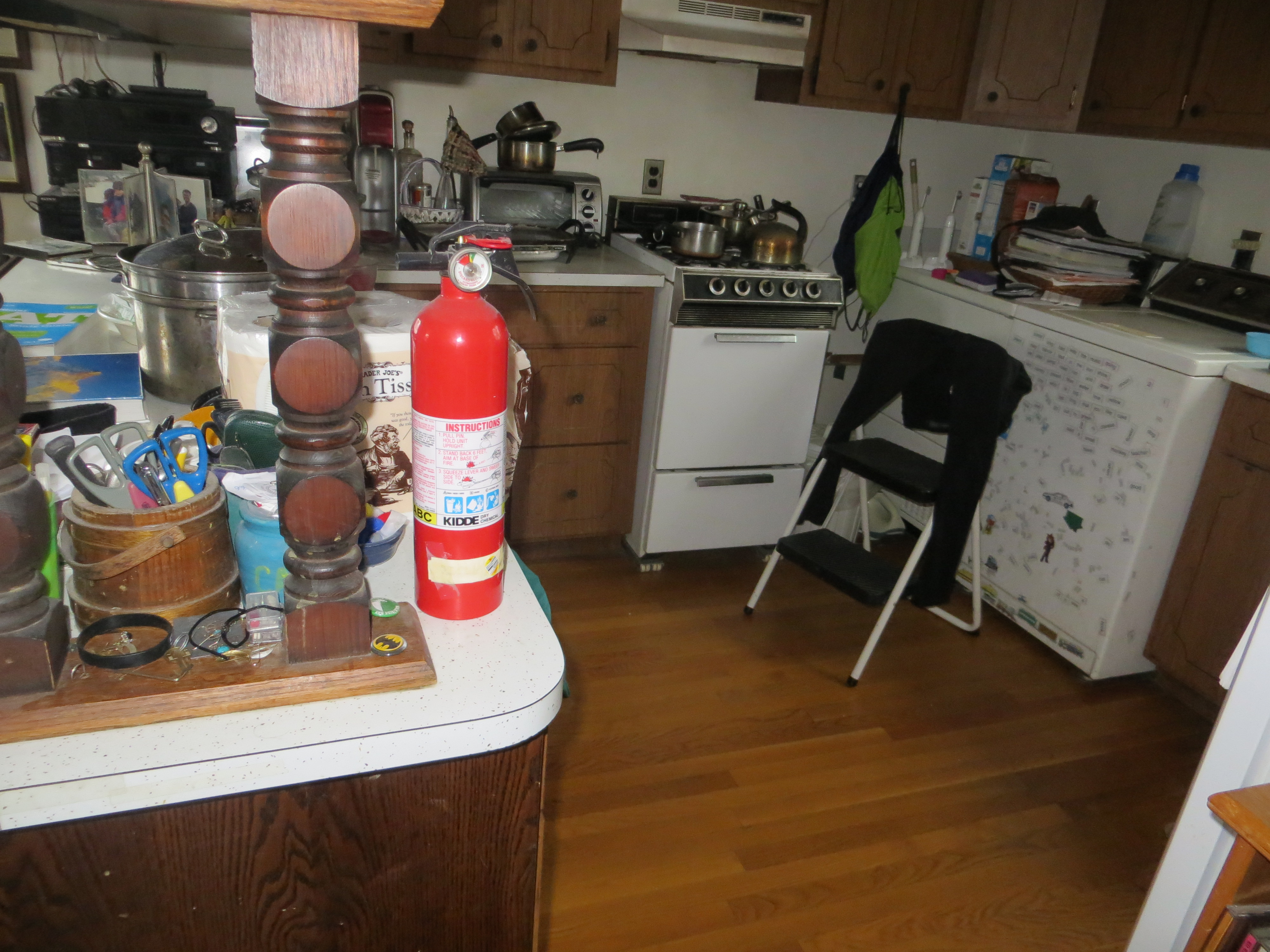 Kitchen fire extinguisher mounted on a wall